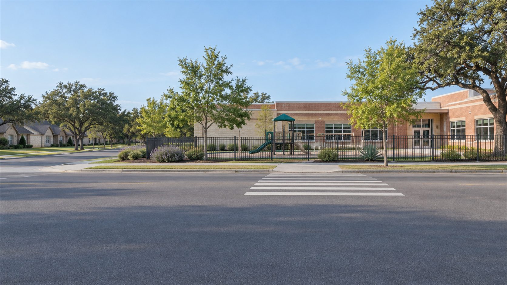 Illustration of a San Antonio-style brick school beside a quiet street, fenced empty playground and striped crosswalk.